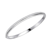A single sterling silver hinged bangle with a textured, striped coil design, shown on a white background.